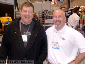 Lil' Orbits operator Danny Quinn visits with VP Brian O'Gara at a trade show