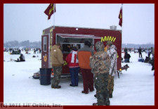 Rich Hogan making mini donuts at an ice fishing festival